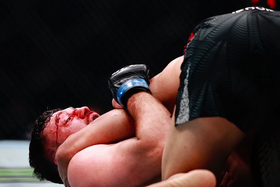 Eric Nolan on the floor and Farman Hasanov on him