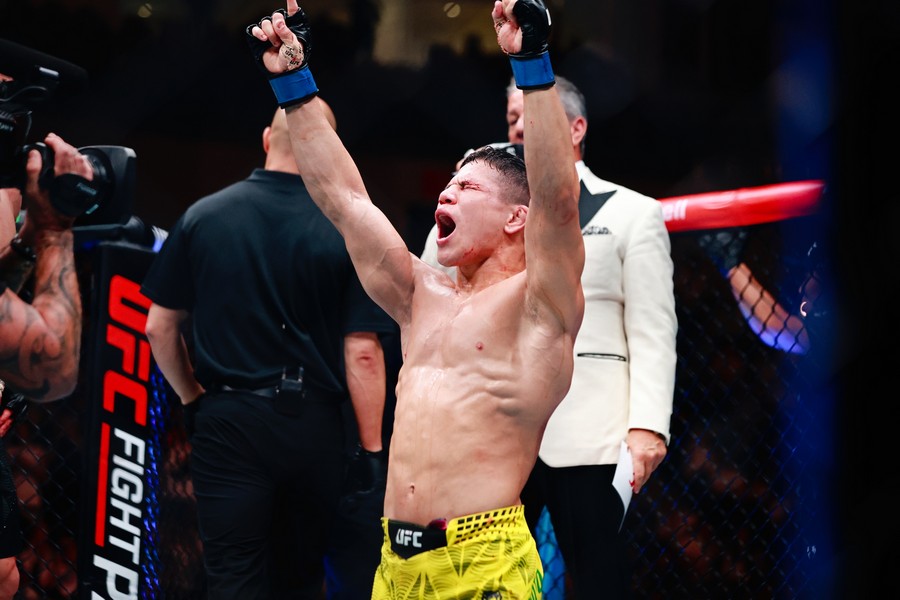 Jean Matsumoto celebrates his win for defeating Bekzat Almakhan