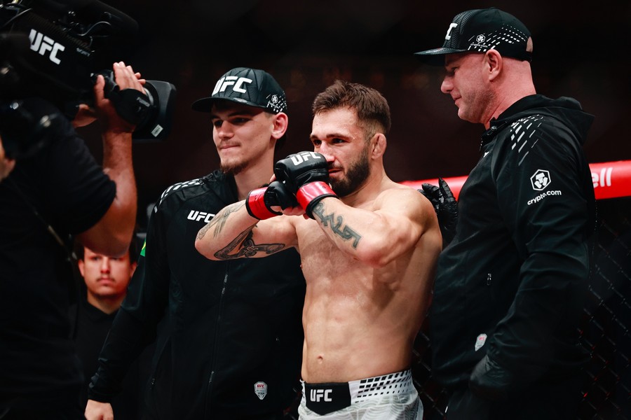 Kaan Ofli showing of his win and power to the camera
